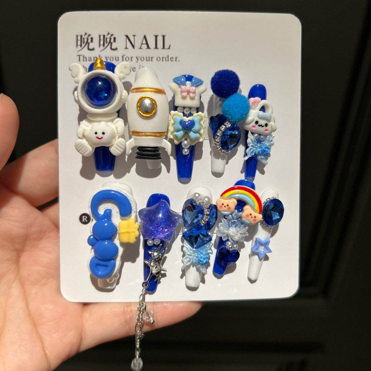 Klein Blue & White Stiletto Press-on Nails with 3D Astronaut, Rocket, Rainbow Bear, Fluffy Ball, and Interlinked Chain - Space Kawaii Fake Nail Set