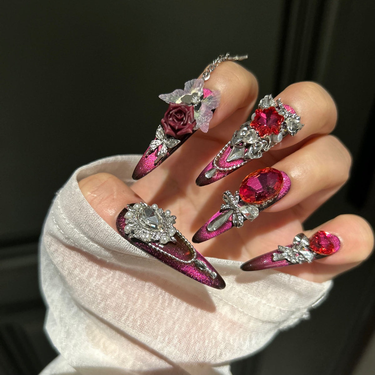 Burgundy Cat Eye Stiletto Press-on Nails with Oversized Ruby Crystals, 3D Dark Red Rose, Bow, and Interlinked Chain - Gothic Glam Fake Nail Set