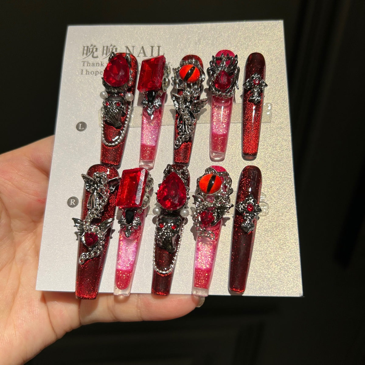 Handcrafted Designer Dark Aesthetic Press-on Nails - Shimmering Red-Black Base with Heavy 3D Gemstones, Skull Art and Cross Decals