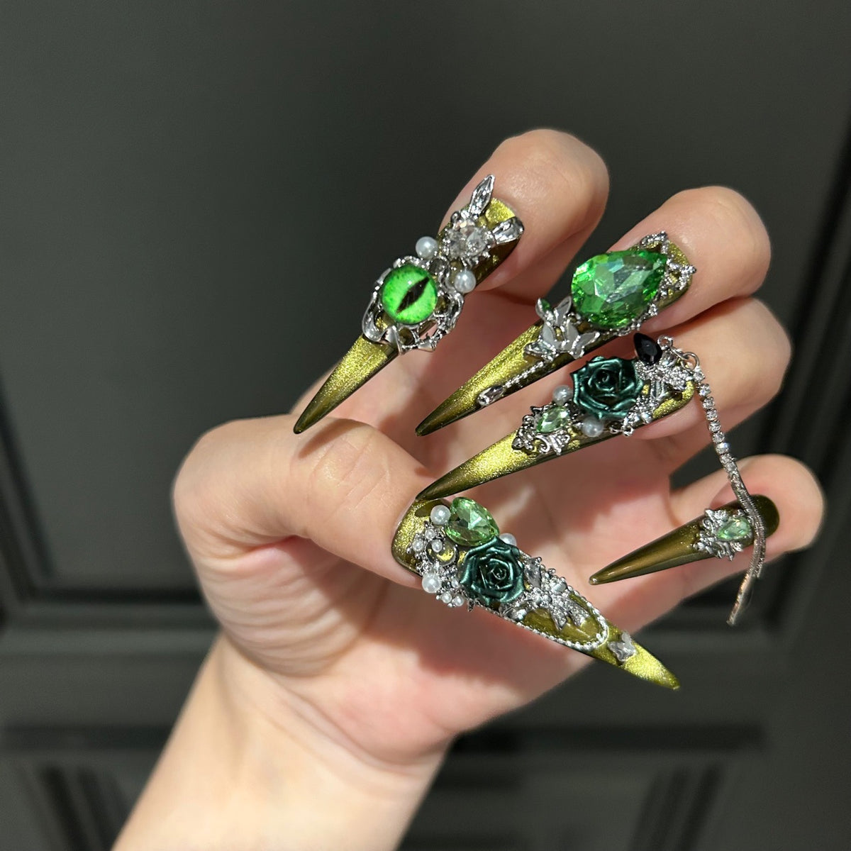 Handmade Olive Green Cat Eye Press On Nails, Long Stiletto Witch Fantasy False Nails with 3D Dark Green Roses, Green Devil Eye Charms, Emerald Rhinestones, Pearls, Silver Bows & Dangling Silver Chains, Reusable Fake Nails for Cosplay, Halloween & Party