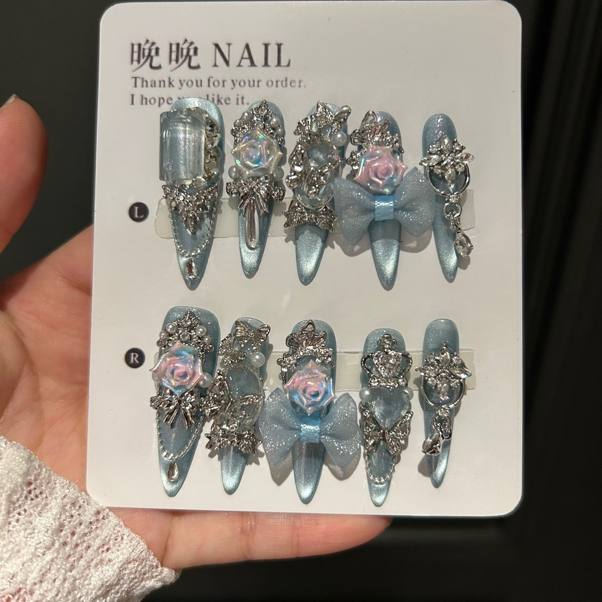 Handmade Ice Blue Cat Eye Long Stiletto Press On Nails with Iridescent 3D Roses, Glitter Bows, Butterfly Rhinestones, Pearls & Dangling Silver Chains