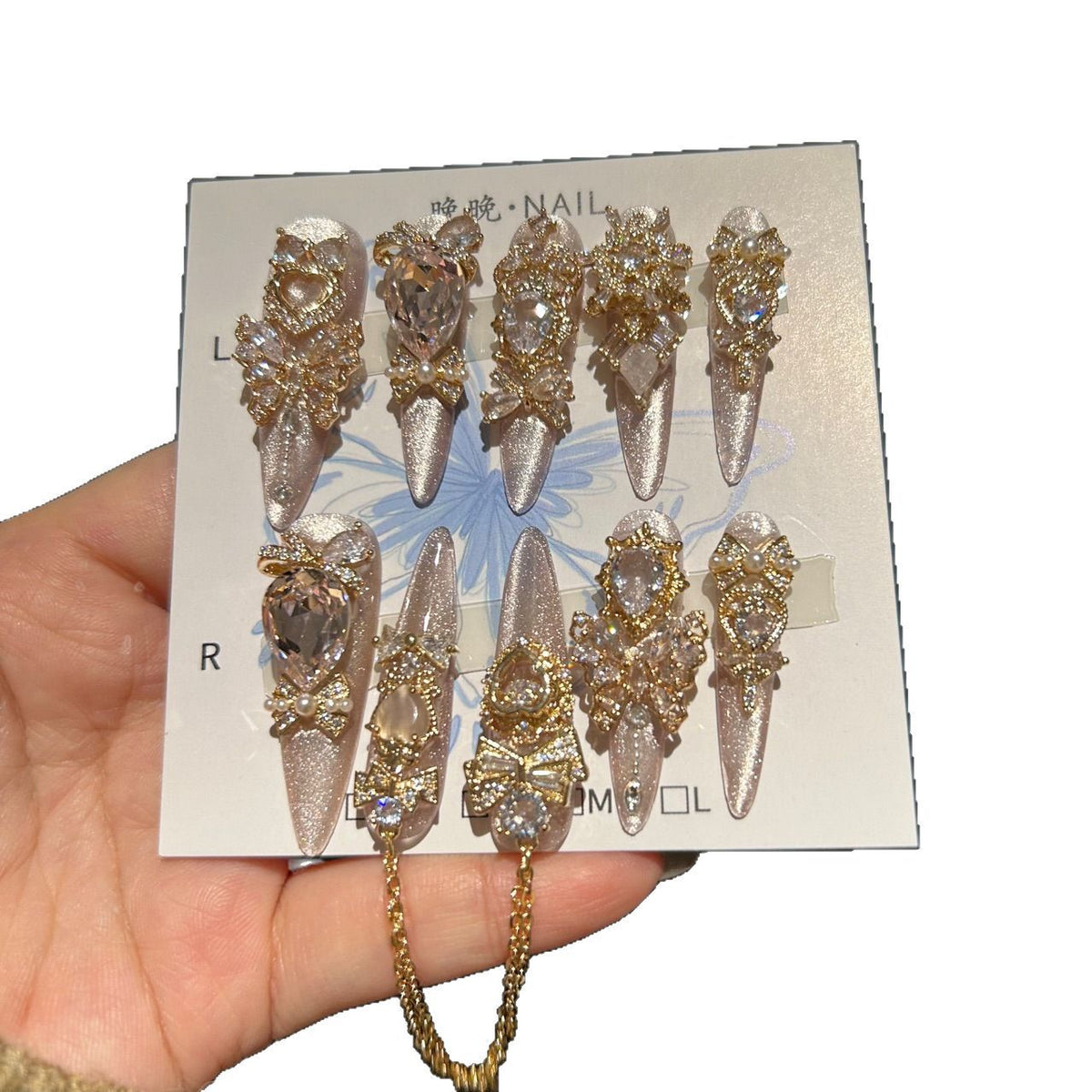 Champagne Pink Cat Eye Stiletto Press-on Nails with 3D Bowknot, Crystal Jewels, and Hanging Chain Charms - Luxury Statement Fake Nail Set