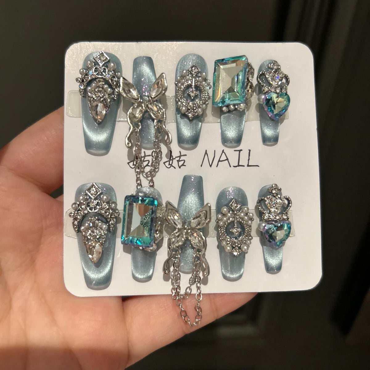 Handmade Ice Blue Cat Eye Long Coffin Press On Nails with Giant Aqua Crystals, Silver Butterfly Charms, Crown Ornaments & Hanging Chain Tassels