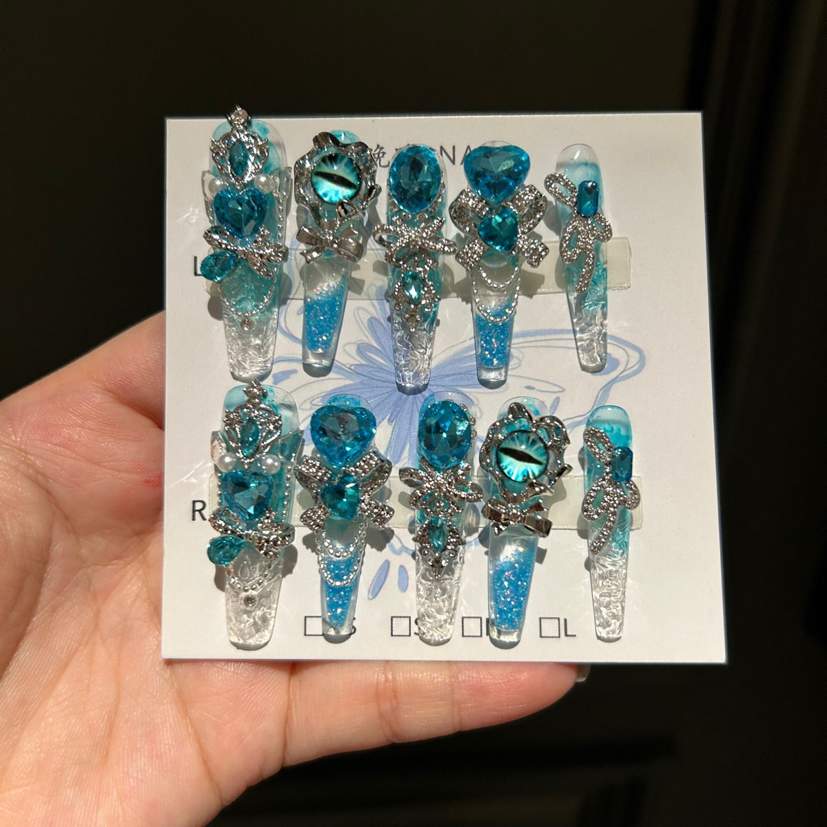 Handmade Blue Glitter Gradient Long Coffin Press On Nails with Blue Evil Eye Charms, Large Blue Heart Crystals, Rhinestone Bows & Silver Chains