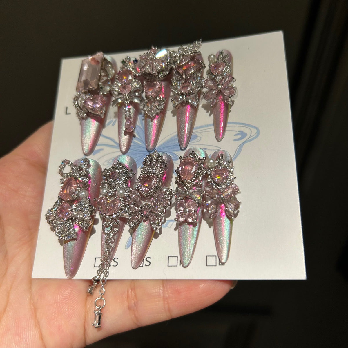 Holographic Pink Cat Eye Stiletto Press-on Nails with 3D Pink Crystal Gems, Bowknot, and Hanging Chain Charms - Luxury Fairy Fake Nail Set