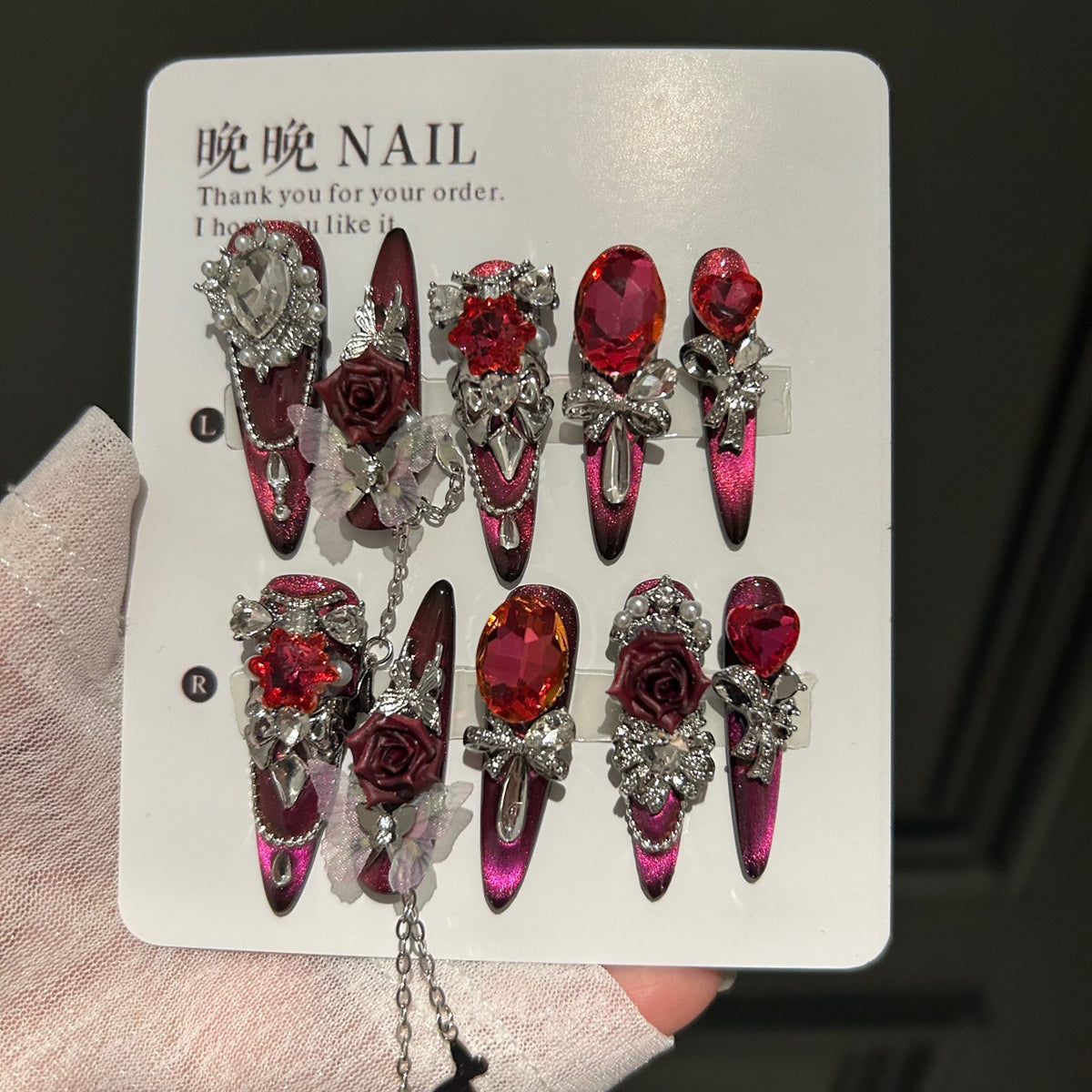 Burgundy Cat Eye Stiletto Press-on Nails with Oversized Ruby Crystals, 3D Dark Red Rose, Bow, and Interlinked Chain - Gothic Glam Fake Nail Set