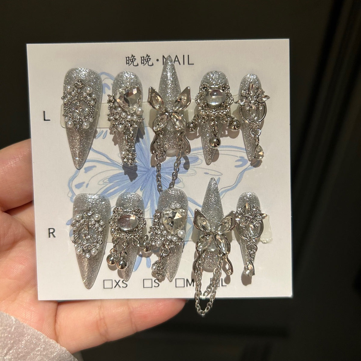 Handcrafted Designer Silver Press-on Nails - Shimmering Cat Eye Base with Heavy 3D Crystals, Pearls and Interconnected Chains