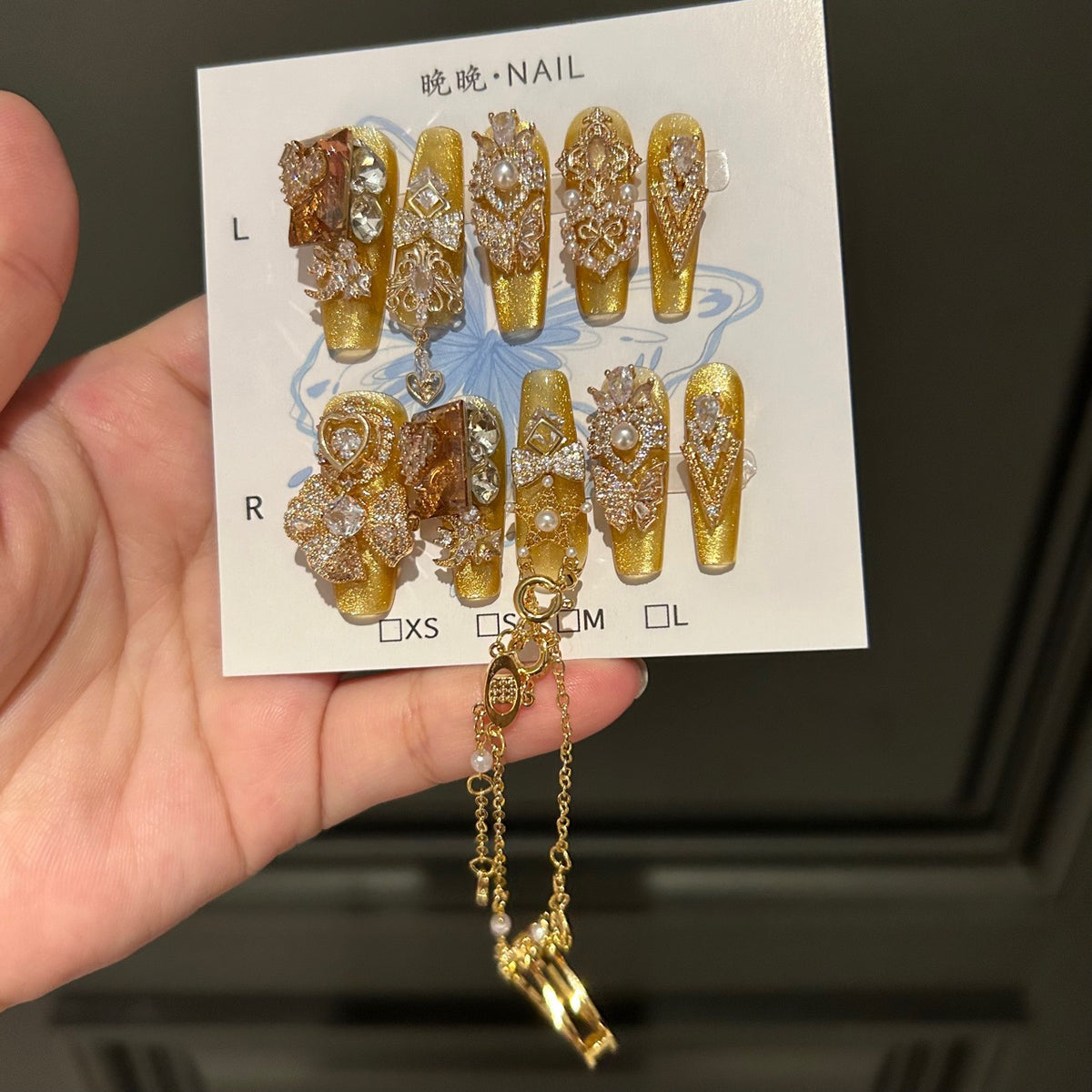 Gold Cat Eye Coffin Press-on Nails with 3D Bowknot, Crystal Rhinestones, and Connected Finger Ring Chain - Luxury Statement Fake Nail Set