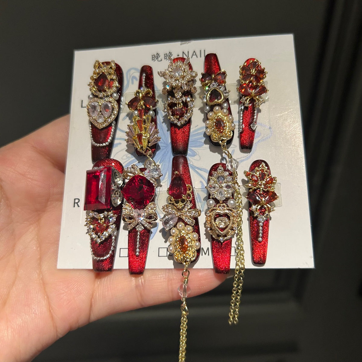 Handcrafted Designer Ruby Press-on Nails - Shimmering Cat Eye Base with Heavy 3D Red Gemstones, Gold Filigree and Chain Drops