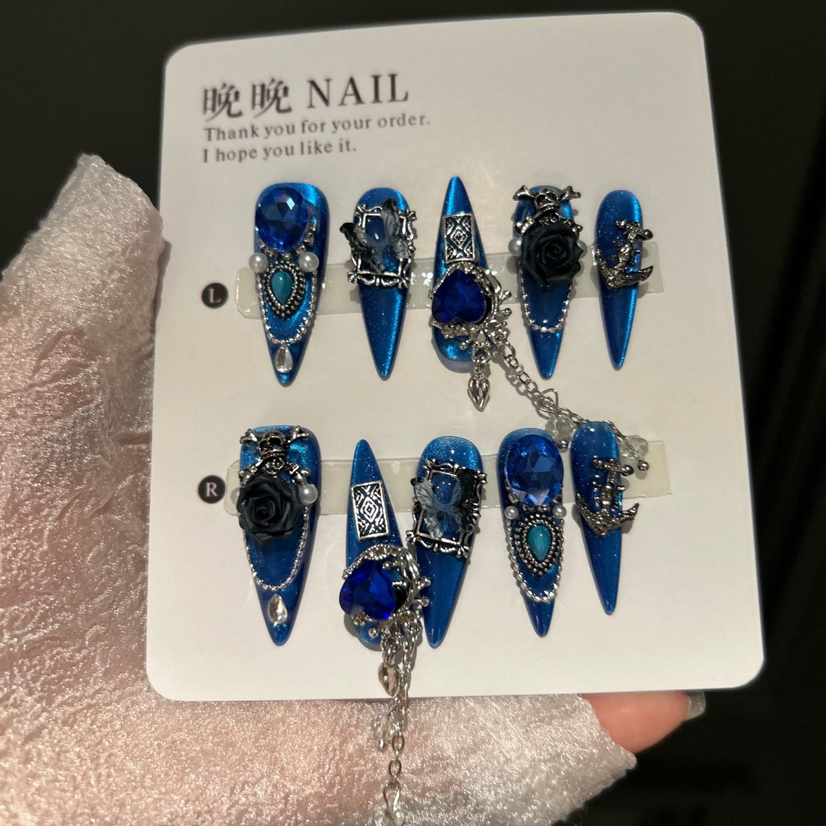 Royal Blue Cat Eye Stiletto Press-on Nails with Oversized Blue Crystals, 3D Black Rose, Skull, Vintage Frame, and Interlinked Chain - Gothic Cyber Fake Nail Set