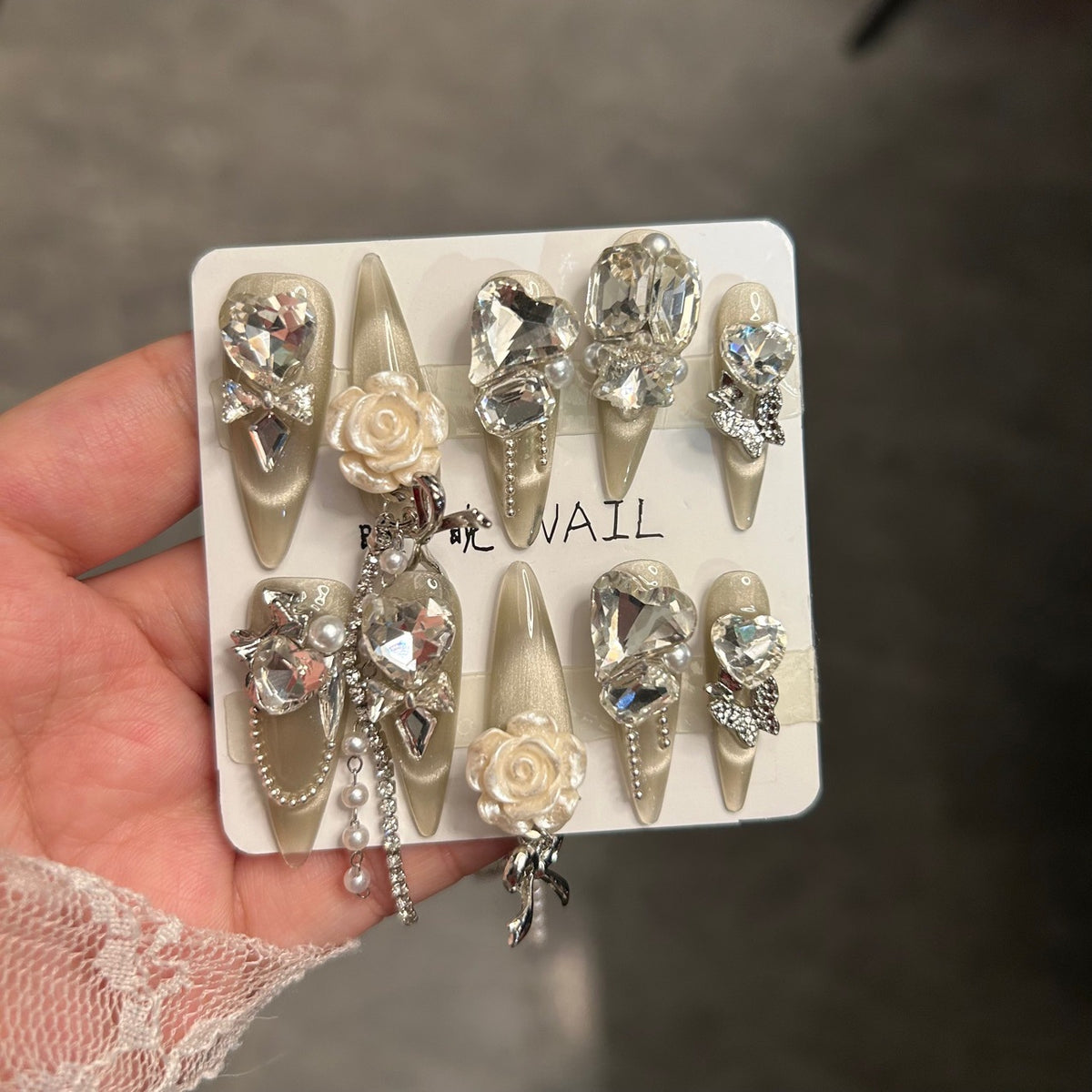 Champagne Cat Eye Stiletto Press-on Nails with Oversized Crystal Diamonds, 3D White Rose, Bow, and Pearl Rhinestone Chain - Luxury Glam Fake Nail Set