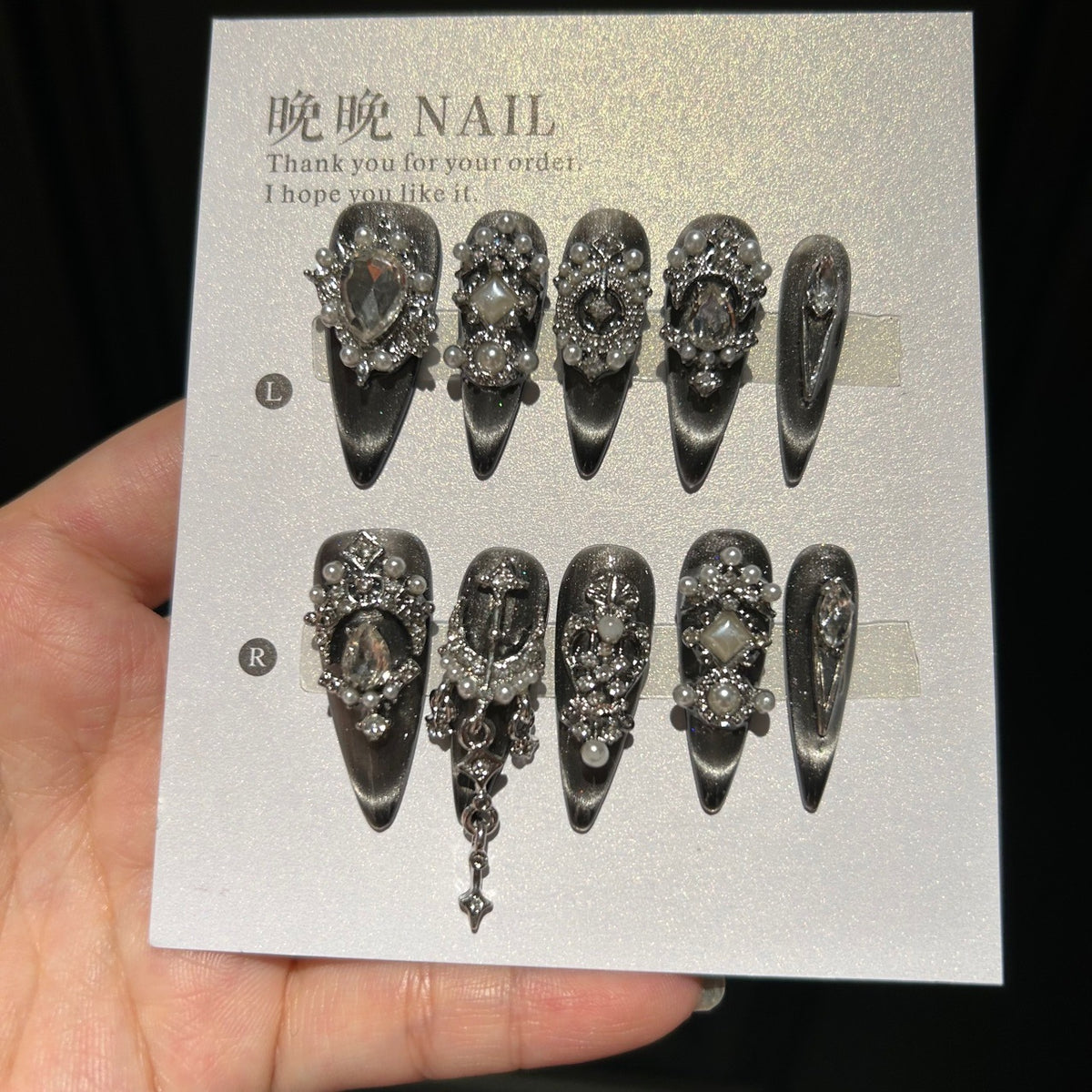 Handmade Black Silver Cat Eye Press On Nails, Long Stiletto Gothic False Nails with Cross Charms, Pearls, Large Rhinestones & Dangling Chain, Reusable Fake Nails for Party & Cosplay
