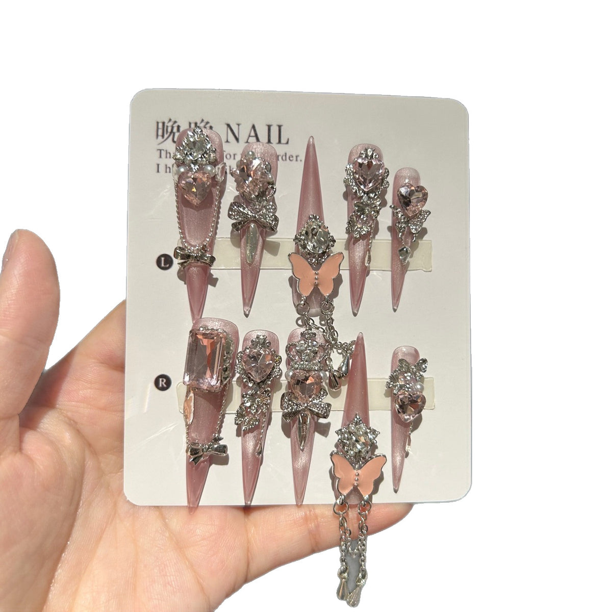 Handmade Soft Nude Pink Press On Nails, Long Stiletto Princess False Nails with Pink Heart Rhinestones, 3D Butterfly, Silver Bow Charms, Pearls & Dangling Silver Chain, Reusable Fake Nails for Wedding & Party