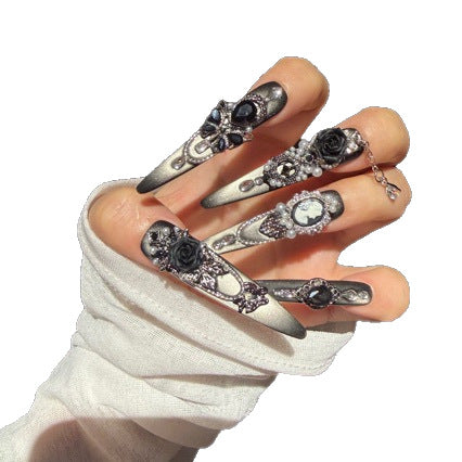 Handmade Black Silver Ombre Long Stiletto Press On Nails. Dark romantic gothic false nails decorated with 3D black roses, vintage cameo portrait, black gems, pearls, silver rhinestones and dangling silver chains.