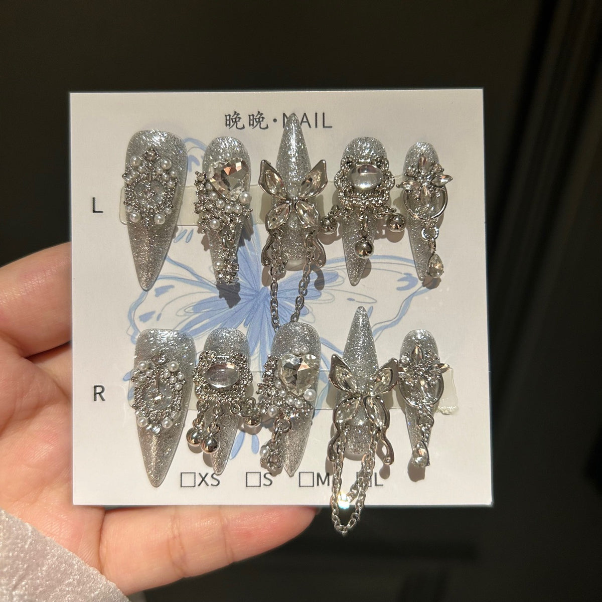 Handcrafted Designer Silver Press-on Nails - Shimmering Cat Eye Base with Heavy 3D Crystals, Pearls and Interconnected Chains
