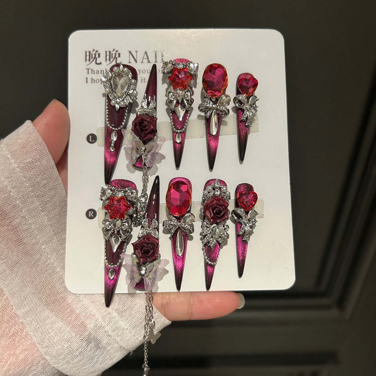 Burgundy Cat Eye Stiletto Press-on Nails with Oversized Ruby Crystals, 3D Dark Red Rose, Bow, and Interlinked Chain - Gothic Glam Fake Nail Set
