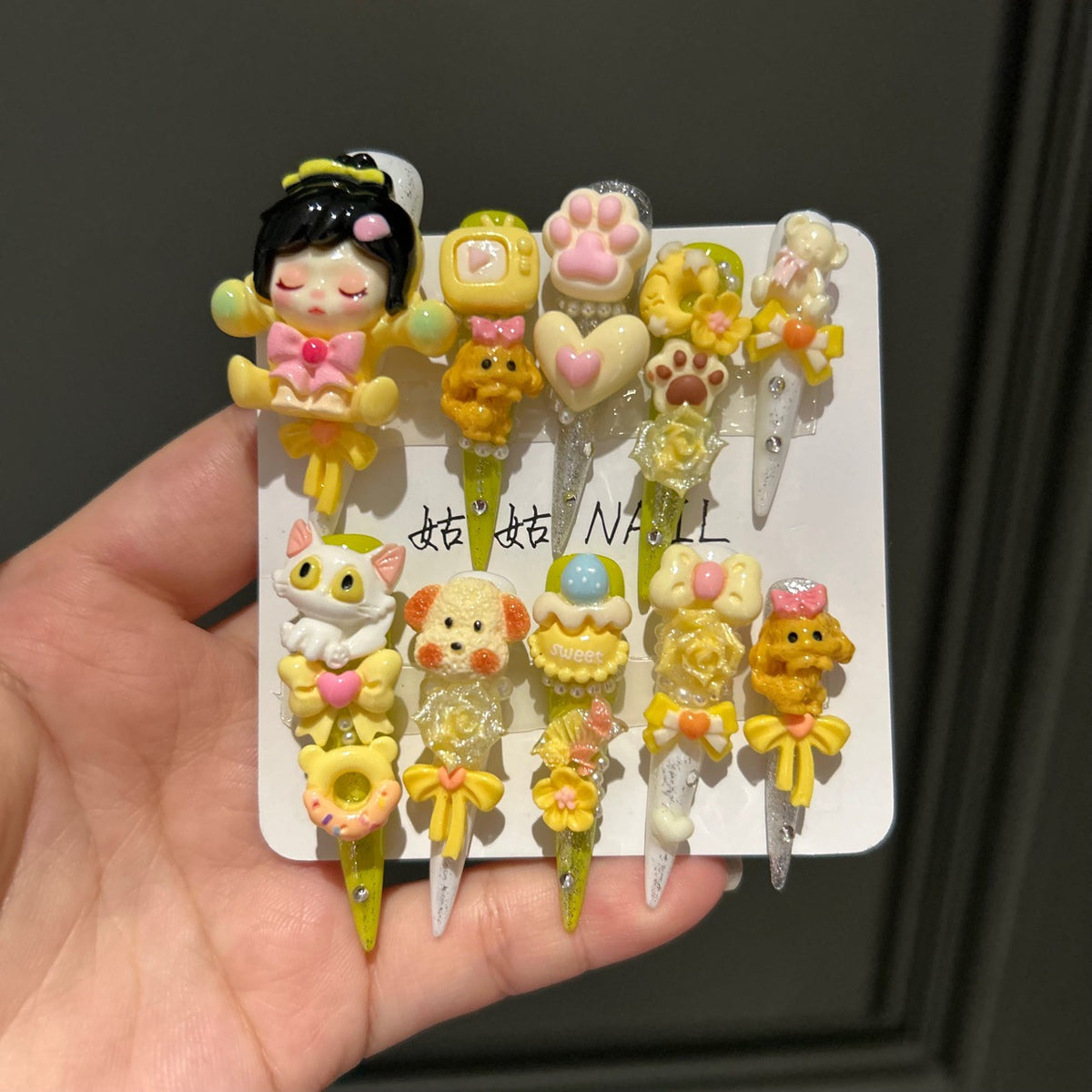 Yellow Kawaii Stiletto Press-on Nails with 3D Anime Doll, Cat Paw, Cute Puppy, and Floral Charms - Playful Art Toy Fake Nail Set